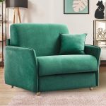 Fauteuil convertible 1 place en daim vert émeraude avec passepoil de la même couleur. Il est fermé avec un coussin vert vert émeraude